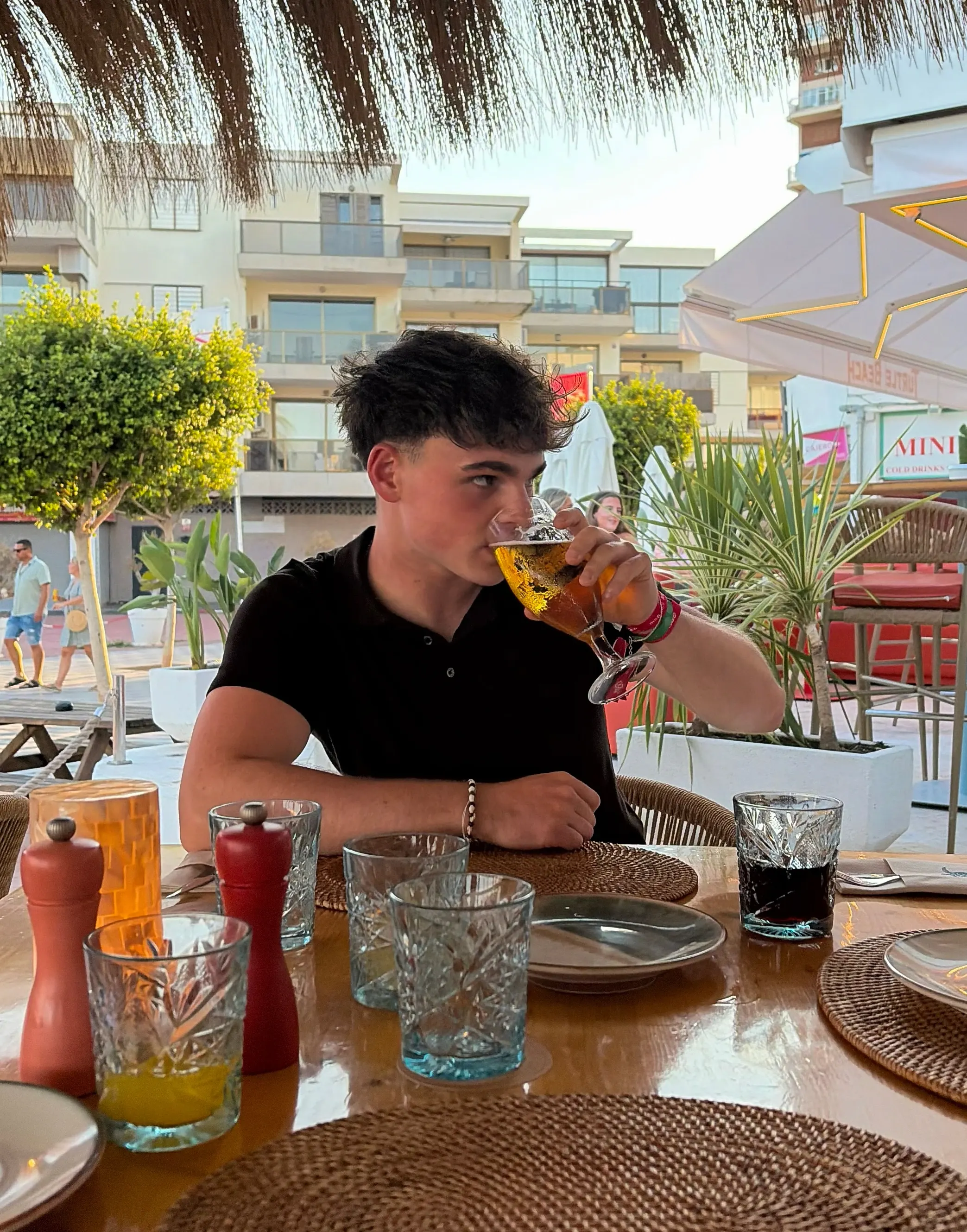 Ryan at a seaside restaurant table while travelling