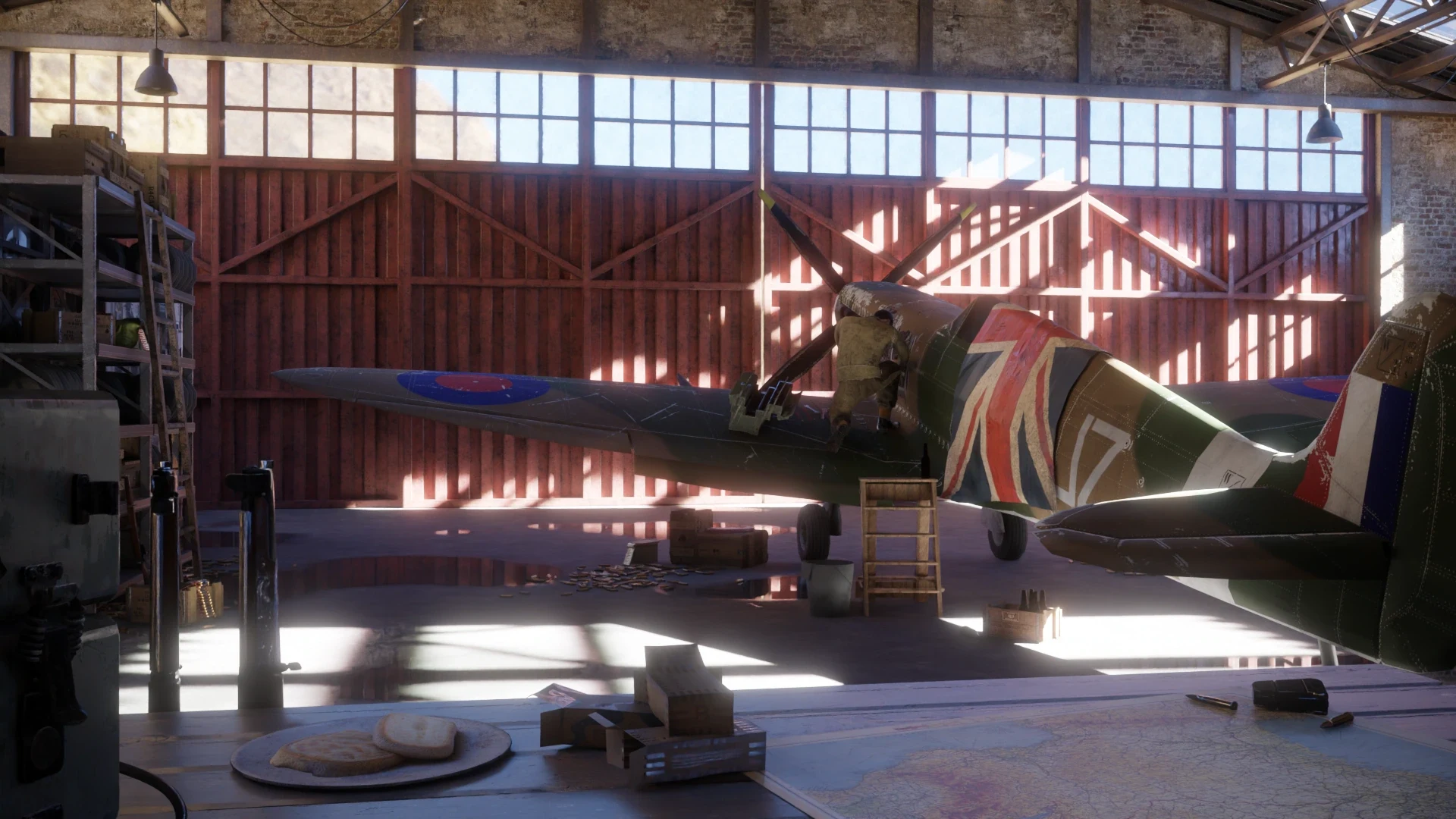 Early hangar render: the Spitfire with a figure working at the engine, a plate of bread and crates in the foreground