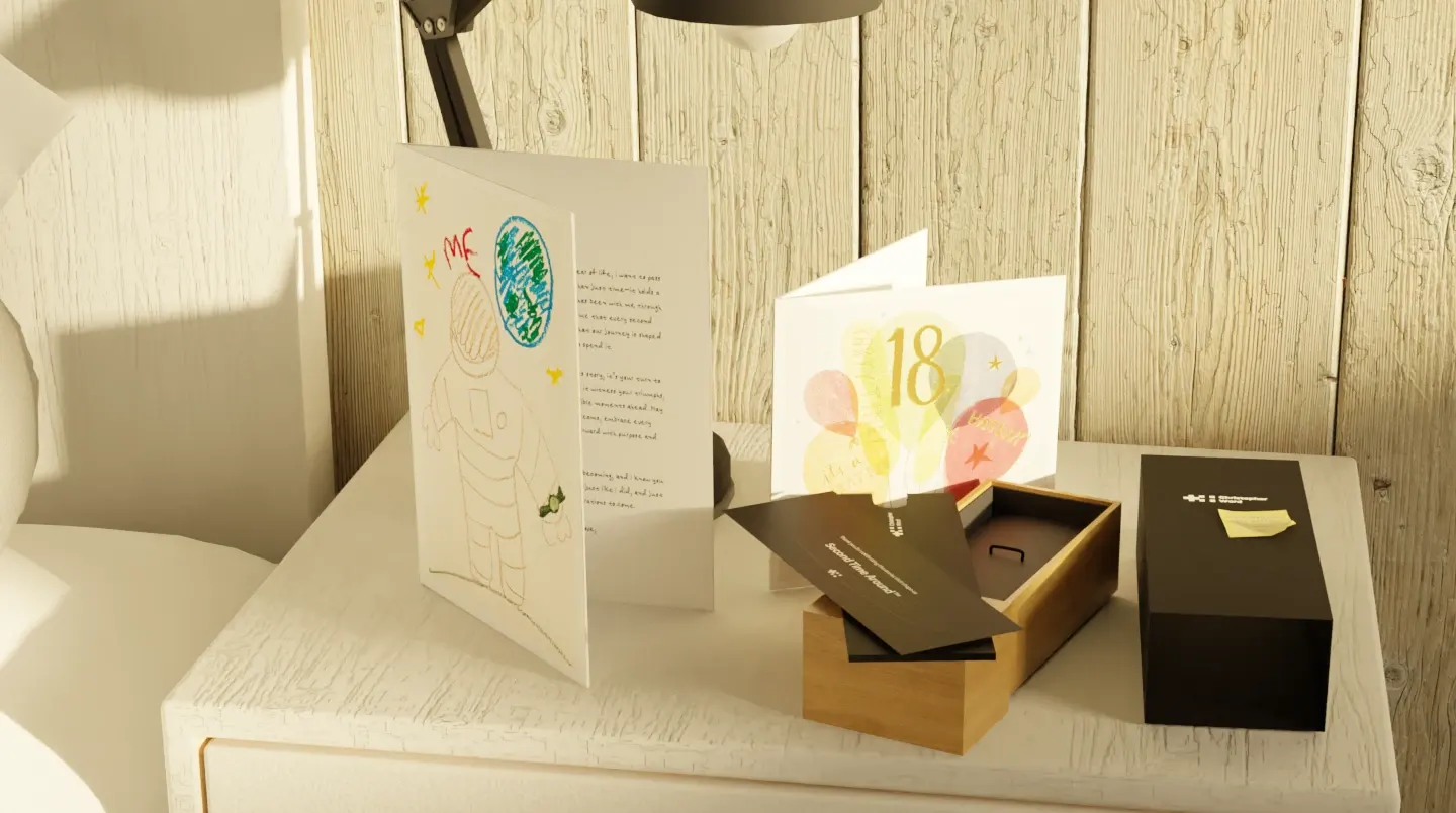Animation still: an 18th birthday card beside the open watch box